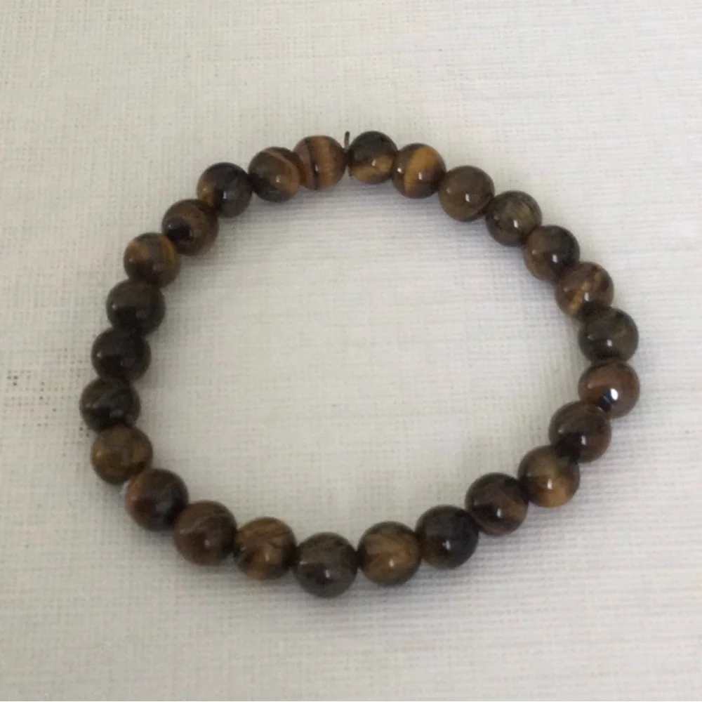 Woman’s Cats Eye Polished Beaded color brown stretch elastic